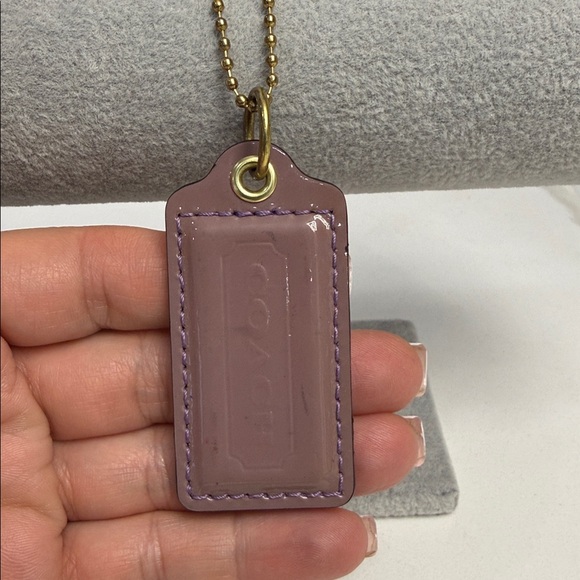 Coach Accessories - Coach hangtag mauve color large with gold chain